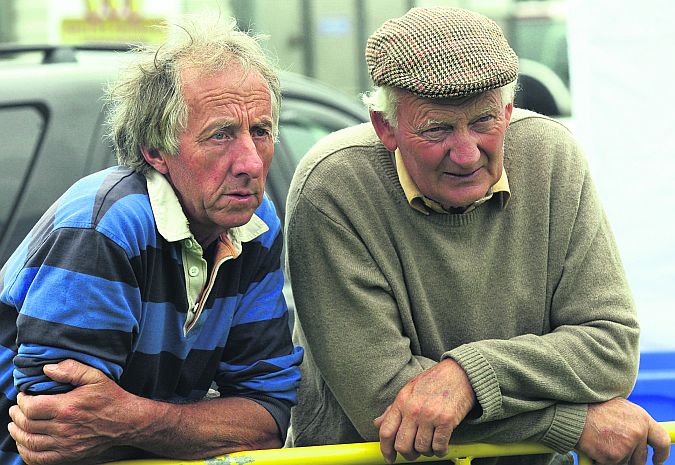 Matt Lynch, Corrandulla and Pat Davoren, Headford, watch the judging of the cattle classes at the Corrandulla Show last Sunday.