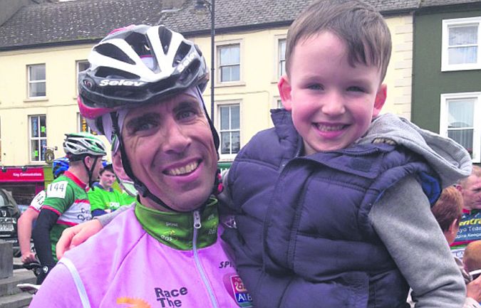 Mike McNena pictured with his son Cillian during the Rás recently.