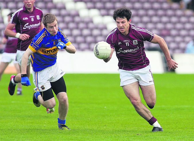 Galway's Sean Armstrong, who is pushing hard for a starting place, pictured in action against Tipperary's Brian Fox in last year's All-Ireland football qualifier. The teams will renew rivalry in Tullamore on Saturday evening.