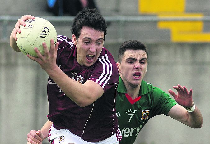 Galway's Eoin Finnerty secures possession ahead of Mayo's Conor Kilkenny during the Connacht minor football semi-final at Tuam Stadium on Saturday evening. Photo: Enda Noone.