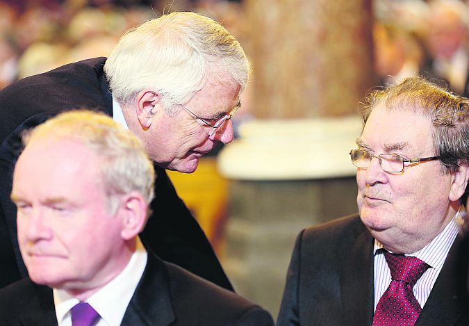 Former British Prime Minister John Major chatting with John Hume and Martin McGuinness in the Church of the Sacred Heart in Donnybrook with the Reynolds family for the funeral mass of former Taoiseach Albert Reynolds.