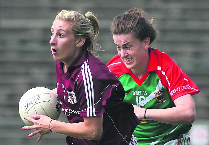 Galway captain Sinéad Burke in action against Mayo's Kathryn Sullivan in July's Connacht final.