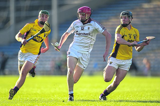 Galway half forward Cathal Mannion is chased by Wexford's Aidan Nolan, left, and Andrew Kenny during Saturday's All-Ireland U21 hurling semi-final at Semple Stadium. Photos: Stephen McCarthy/Sportsfile.