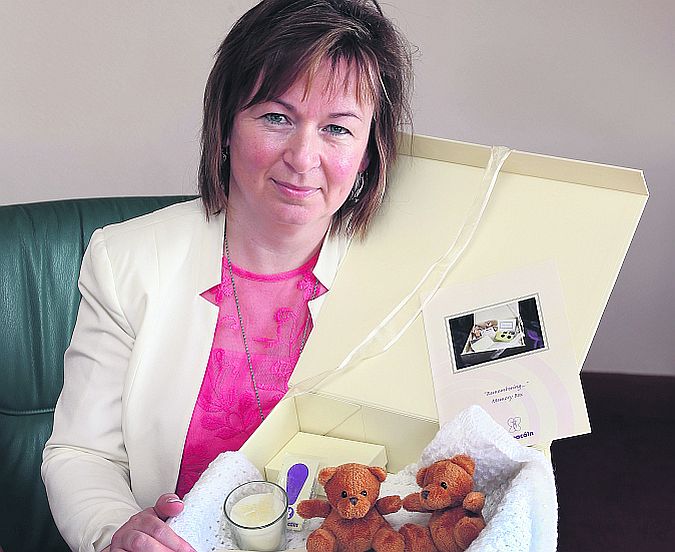 Jacinta Murphy with the Memory Box,which contains a knitted blanket and two teddies, one to remain with the baby and the other with the mum and dad. PHOTO: JOE O'SHAUGHNESSY.