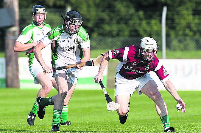 Killimordaly's Paul Madden is about to secure possession ahead of Sarsfields Eamon Cleary during the clubs' county champoionship tie at Kenny Park on Saturday, Photos: Joe O'Shaughnessy.