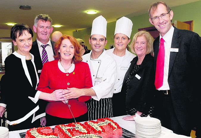 Marie O'Malley, Denis McElligott, Deputy Kathleen Lynch, Minister of State of the Department of Health, Emanuele Feare, Sarah McDonagh, Helen Madden and Pat Kennedy.prepare to cut a cake to mark the opening of the Clarinbridge Nursing Home's new services. Photo: Stan Shields.