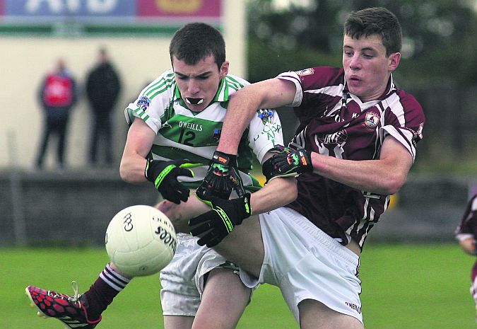 Annaghdown's Pierce Glynn and Oughterard's Paul Walsh battle for possession during the County Minor B Gaelic Football Championship Final at Tuam Stadium on Sunday. Photos: Enda Noone.