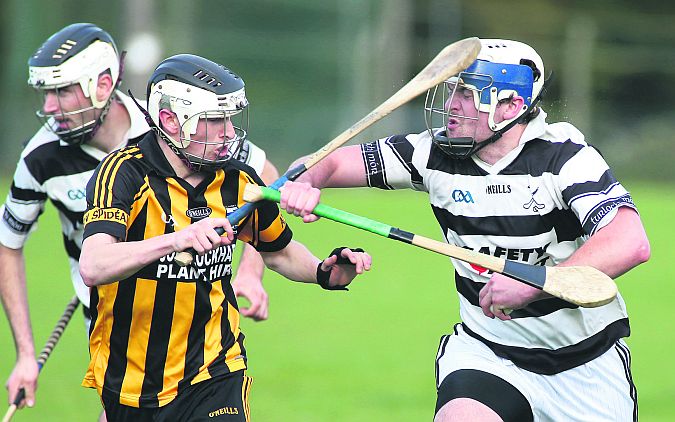 Stiofan Ó Fatharta of An Spidéal and Turloughmore's Justin Brennan in a battle for possession in Clarinbridge. Photos: Joe O'Shaughnessy.