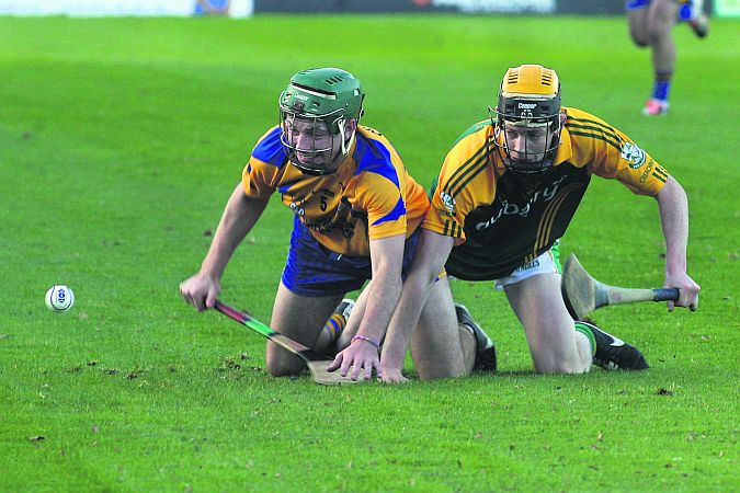 Ground hurling: Portumna's Colin Burke and Craughwell's Cian Larkin get low down in their battle for possession. Photos: Enda Noone.