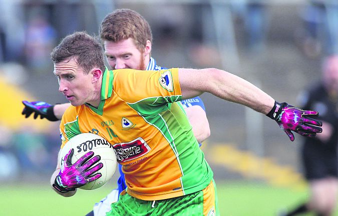 Corofin's Gary Sice secures possession ahead of St. Michael's John Hanbury during Sunday's county football final at Tuam Stadium. Photo: Joe O'Shaughnessy.