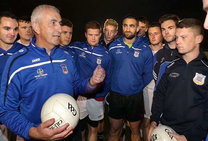 St Michael's manager John Kenny speaking to players before training as they prepare for Sunday's county final. Photos: Joe O'Shaughnessy.