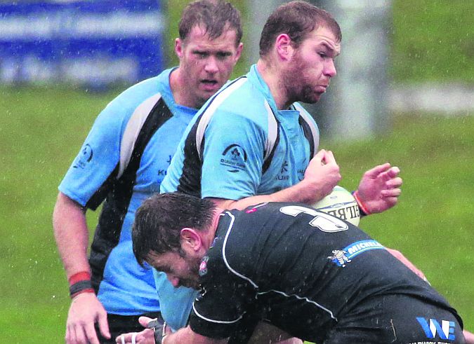 Galwegians forward Jack Dinneen has his progress halted by Ballymena's Bryan Young during Saturday's Ulster Bank All-Ireland League Division 1B tie at Crowley Park. Photo: Joe O'Shaughnessy.