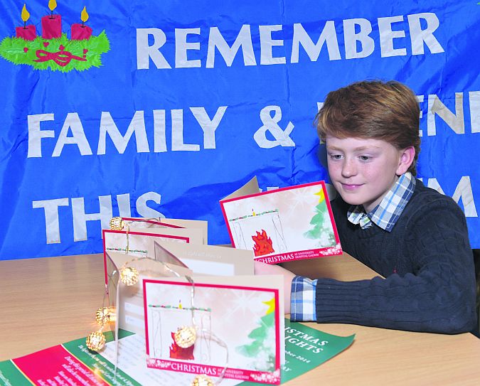 Killanin NS pupil Tiernan Conneely - designer of the card - at the launch of the Children’s Remembrance Day Committee Christmas Cards and lights at University Hospital Galway last week.