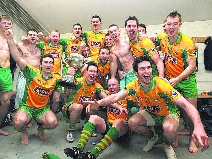 Corofin captain Michael Farragher and his team-mates celebrate with the Shane McGettigan Cup after their Connacht Club senior football final win over Ballintubber last Sunday. Photo: Enda Noone.