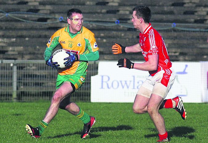 Corofin's Gary Delaney eyes up his options as Ballintubber's Cillian O'Connor closes in during the Connacht Senior Club Football Final at MacHale Park on Sunday. Photo: Enda Noone.