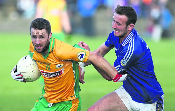 Corofin attacker Michael Lundy, in action against St. Michael's Brian Madden, should prove a handful for the Aughawillan defence in Sunday's Connacht Club football semi-final in Carrick-on-Shannon.