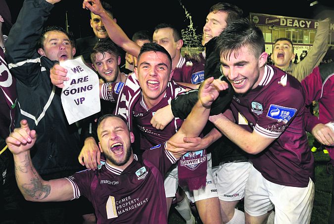 Galway FC players Alex Byrne, Enda Curran and Ryan Manning celebrate their promotion to the Premier Division after defeating UCD 3-0 at Eamonn Deacy Park on Friday evening. Photo: Joe O'Shaughnessy.