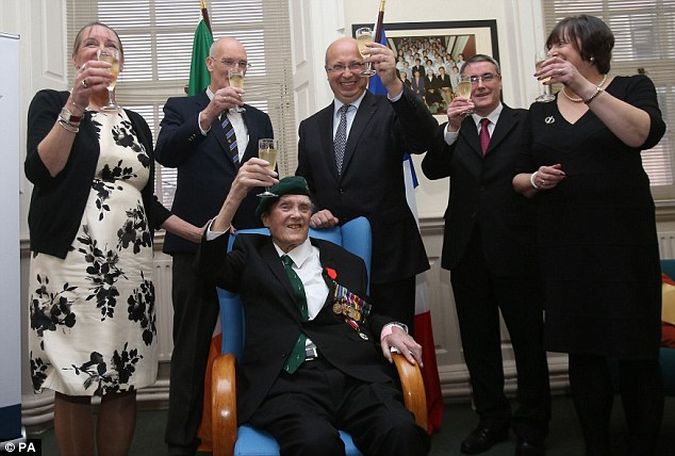 City native Pat Gillen (seated) was joined by his children, (left to right) Mary, Robin, Gerard and Patrica as he received the honour from French Ambassador Jean-Pierre Thebault (centre, rear) at Mercy Hospital in Cork this week.