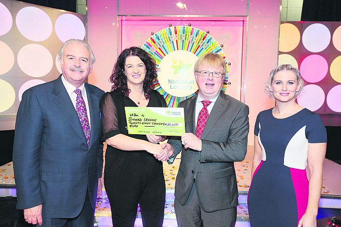 Sinead Irvine from Furbo won €28,000 on last Saturday's National Lottery Winning Streak game show on RTE. Pictured here at the presentation of the winning cheques were from left: Marty Whelan, Winning Streak game show co-host; Sinead Irvine the winning player, Eddie Banville, Head of Marketing, The National Lottery, who made the presentation and Sinead Kennedy, Winning Streak game show co-host.