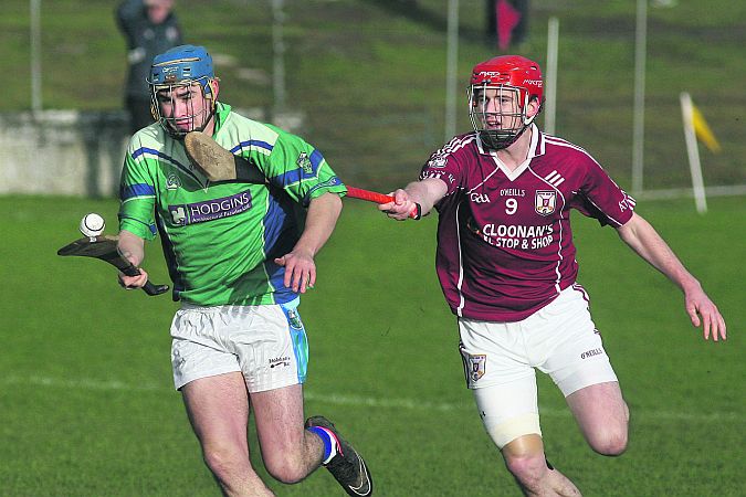 Athenry's Dean Healy gives chase to Tynagh/Abbey-Duniry's Niall Moloney during the County U-21 A hurling final.