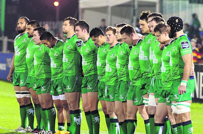 The Connacht team observe a minute's silence in memory of of former Ireland international Jack Kyle before the start of their Guinness Pro12 tie against Scarlets at the Sportsground on Saturday.