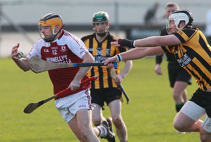 Annaghdown's Cathal Gaffney secures possession ahead of An Spidéal's Einne Ó hEochaidh during Sunday's County Junior A hurling final in Loughrea. Photos: Joe O'Shaughnessy.