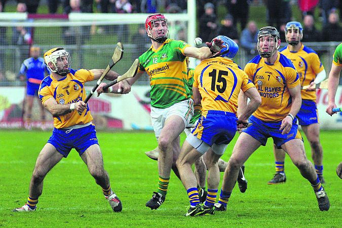 Gort attacker Paul Killilea tussling with Portumna's Leo Smith and Andy Smith during Sunday's senior hurling final at Kenny Park. Photo: Enda Noone.