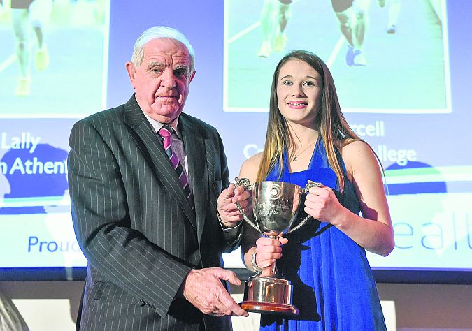 Allanah Lally, Presentation College, Athenry, receives the Schoolgirls Athlete of the Year award from Michael Hunt, President of the Irish Schools' Athletics Association, in the Crowne Plaza Hotel, Santry.