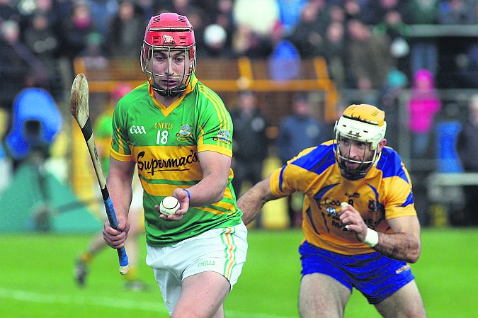 Gort's Jason Grealish prepares to strike as Portumna's Leo Smith closes in during Sunday's Galway hurling final at Kenny Park. Photo: Enda Noone.
