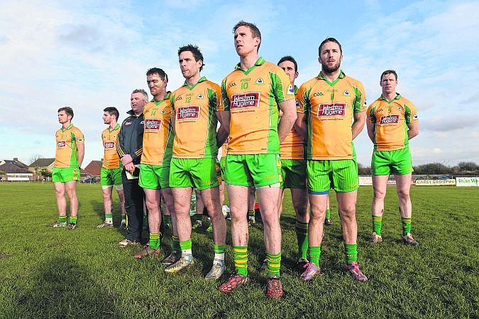 Corofin team members stand during the playing of the national anthem ahead of their All-Ireland Club quarter-final against Tir Chonaill Gaels in Ruislip on Sunday.