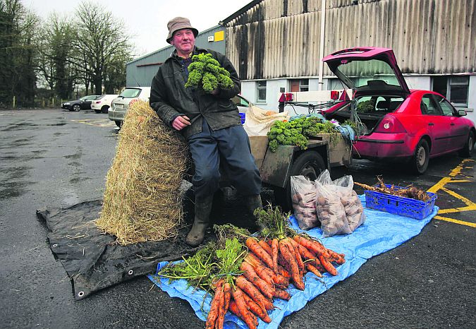 Frank Murphy from Craughwell selling his home produced vegetables outside Loughrea Mart on Saturday. PHOTO: HANY MARZOUK.