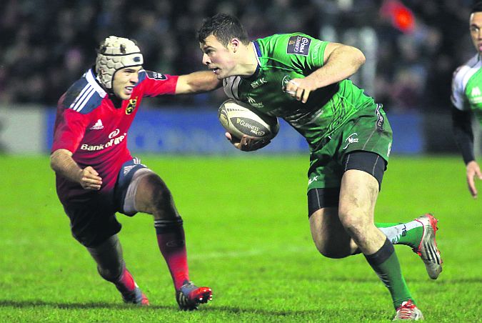 Connacht's Robbie Henshaw on the attack against Munster's Duncan Williams during the Guinness Pro12 encounter at the Sportsground last Thursday. Photo: Joe O'Shaughnessy.