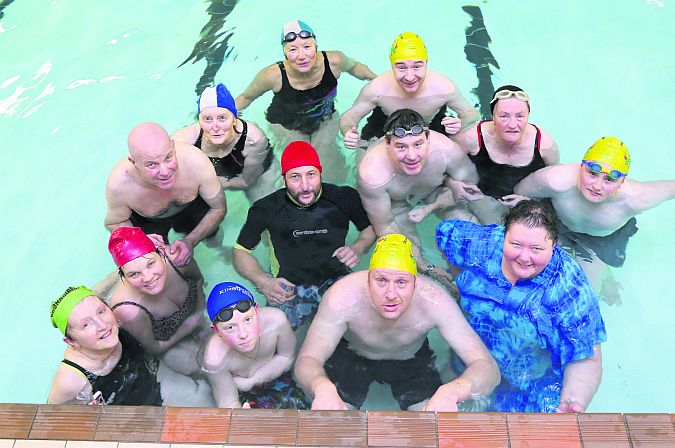 Members of Octopus Swimming Club on their Monday night swim in Kilcornan. Back row - semi circle: Helen O’Connor (green hat), Joanne Stapleton (red hat), Oliver Kane, Phil Flatley (blue & white hat), Eva Anselm (blue & white hat) Shane O’Connor (yellow hat), Bridie Giles (black hat), Dylan O’Boyle (yellow hat). Front - semi circle: Michael Howley (blue hat), Niko Lascar (red hat), Tony Cunningham (no hat), founder of Octopus Swimming Club, Mary Arrigan-Langan (blue top). Centre: Sammy Fleming.