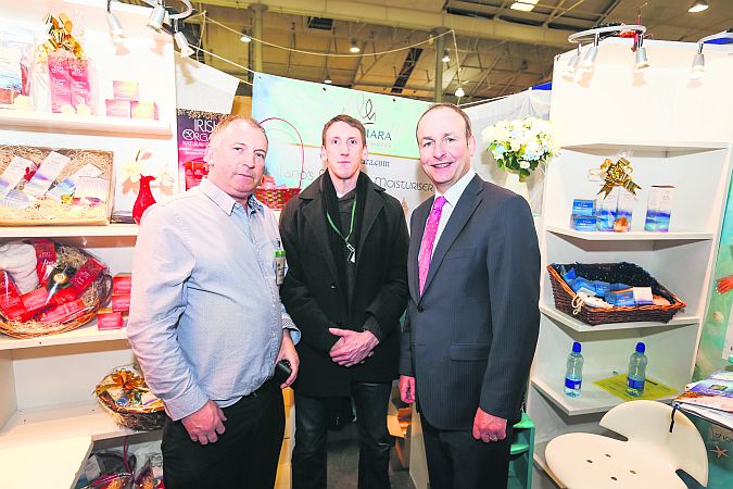 Fianna Fáil leader Micheál Martin pictured with Seamas Mac Cathmhaoil (left) Managing Director of Rí Na Mara, the Connemara-based family owned business which sells a boutique Irish range of Luxury Seaweed Skincare and James Kenny (centre), a buyer of Goutong Consulting, Dublin at the recent Showcase, Ireland’s Creative Expo in the RDS.