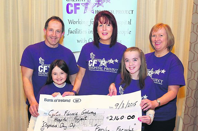 Andy Griffin, Caitlin Griffin and organiser Eilish O’Loughlin from Loughrea presenting a cheque for €2,140 - the proceeds of St. Stephen’s Day Swim at Lough Rea Lake - to Ria and Caitlin Power who represented Cystic Fibrosis, Galway Hospital Project. Picture: Hany Marzouk.