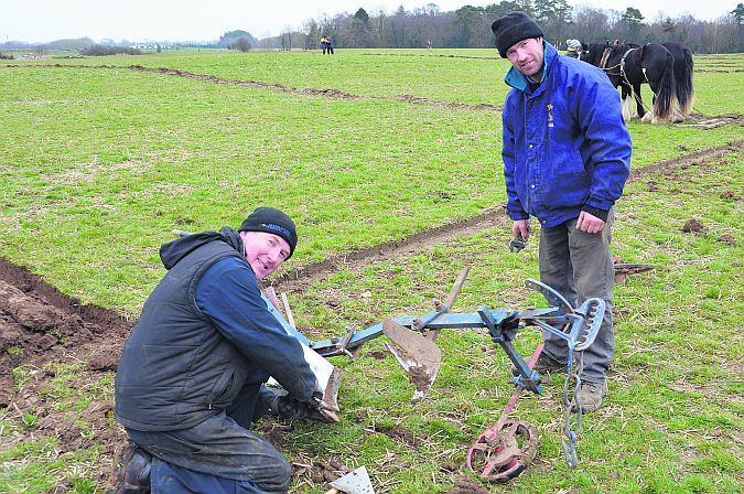 Michael Burke and Eamon McDonagh, Moycullen, carrying out running repairs at the County Galway Ploughing Championships in Ahascragh. Photo: Gerry Stronge.