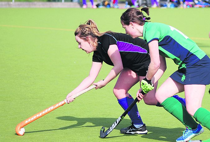 Greenfields Liz Tighe closes in on NUIG's Eleanor Connolly during Tuesday's Connacht Senior Cup final in Dangan.