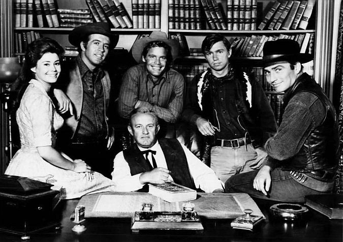 Heroes all . . . The main characters from The Virginian (1964). Centre, Judge Garth (Lee J. Cobb). From left, Betsy Garth (Roberta Shore); Clu Gulager (Sheriff Ryker); Trampas (Doug McClure); ranch hand (Randy Boone) and The Virginian (James Drury).