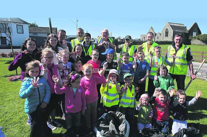 IFA men, Barry Donnelly, Frank Hynes, P.J. Conroy, Colim Killeen, Bertie Roche and Pat Murphy leading a clean-up campaign in the picuresque village of Abbey, Loughrea with the help of the children of the town. PHOTO: HANY MARZOUK.