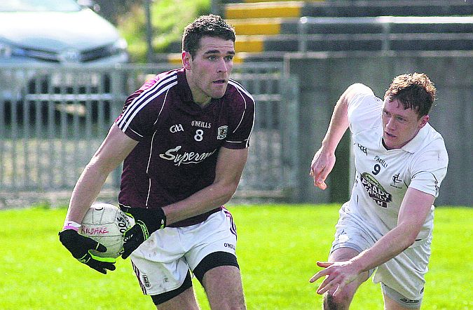 Galway midfielder Fiontan Ó Curraoin breaking away from Kildare's Paul Cribbin during Sunday's Division Two league tie at Tuam Stadium. Photo: Enda Noone.