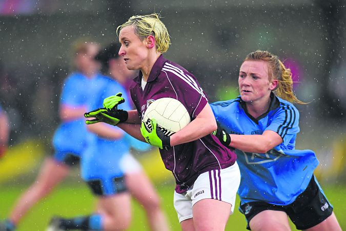 Galway's Edel Concannon brushes past the challenge of Dublin's Carla Rowe. Photos: Paul Mohan/Sportsfile.