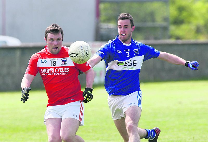 Bearna's Paul Carty and Killanin's Edwin O Muiri follow the fligfht of the ball during Sunday's senior football championship tie in Moycullen. Photo: Joe O'Shaughnessy.