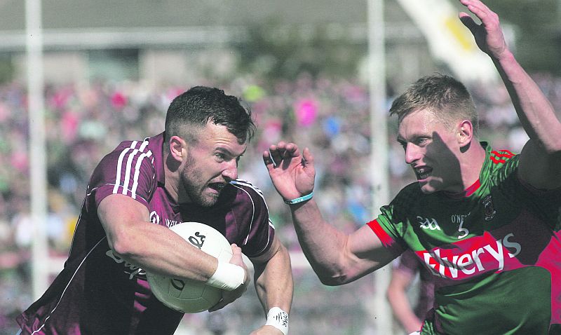 Galway's Peadar Óg O Griofa takes on Mayo's Kevin Keane during Sunday's Galway football semi-final at Pearse Stadium. Photo: Enda Noone.