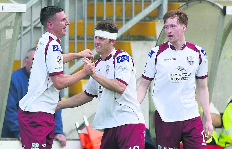 Enda Curran (left) celebrates his goal with Jake Keegan and Gary Shanahan on Friday night. Photo: Joe O'Shaughnessy.