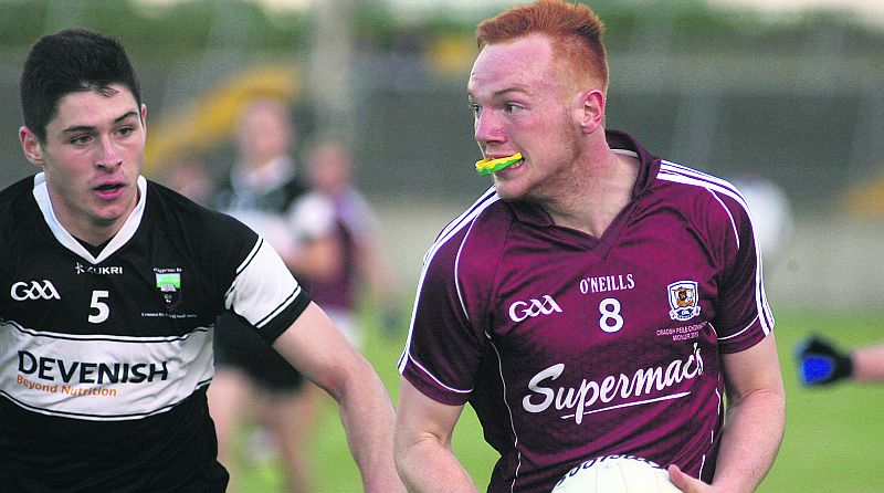 Galway midfielder Colm Ó Braonain eyes up his options as Sligo's Nathan Mullen closes in during the Connacht minor football final replay at Tuam Stadium on Friday evening. Photos: Enda Noone.