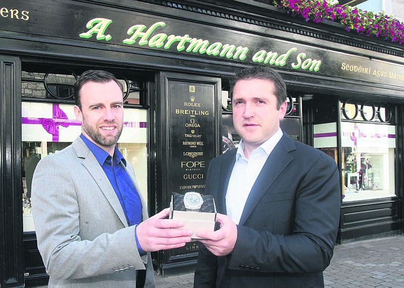 Macron Galway Cup Tournament Director Ronan Gibney accepts the Bulova watch for Player of the Tournament from Richard Hartmann.