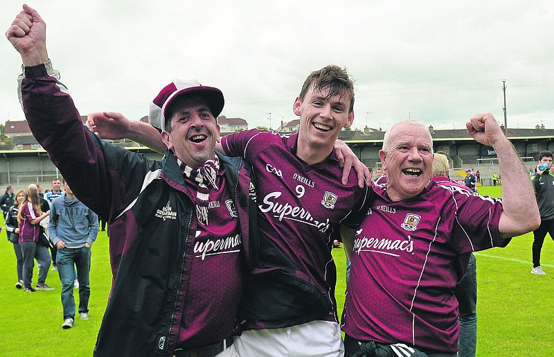 Galway footballer Thomas Flynn celebrates with supporters John Knightly and Gerry Burke from Dunmore after their All-Ireland qualifier victory over Armagh last Sunday. Photo: Matt Browne/Sportsfile.