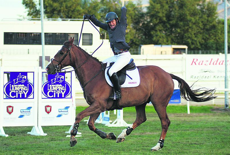 Gaby Corless celebrates after jumping clear in the final round of the puissance in Dublin on Friday. Photo: Laurence Dunne/Jumpinaction.net