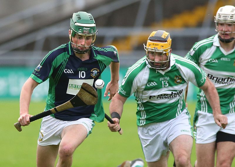 Liam Mellows Ronan Elwood is chased by Castlegar's Ger Farragher during Saturday evening's senior hurling championship city derby at Pearse Stadium. Photo: Joe O'Shaughnessy.