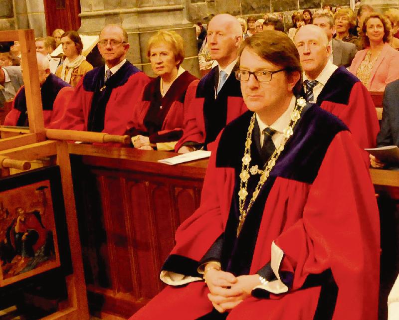 Deputy Mayor Neil McNelis attended contrasting events, both featuring men in robes or dresses